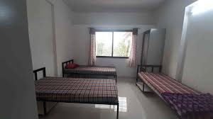 Hostel entrance with security guard and visitors register desk