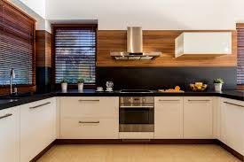 Clean and modern hostel kitchen with refrigerator and cooking facilities